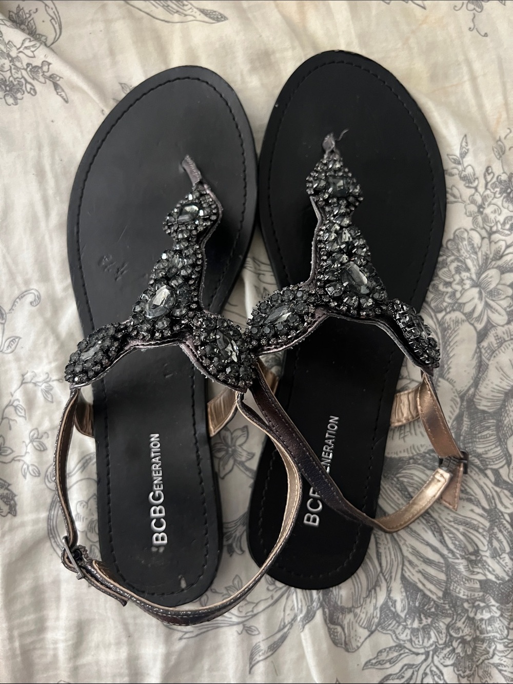 BCBGeneration Black Jeweled T-Strap Sandals with Metallic Rose Straps